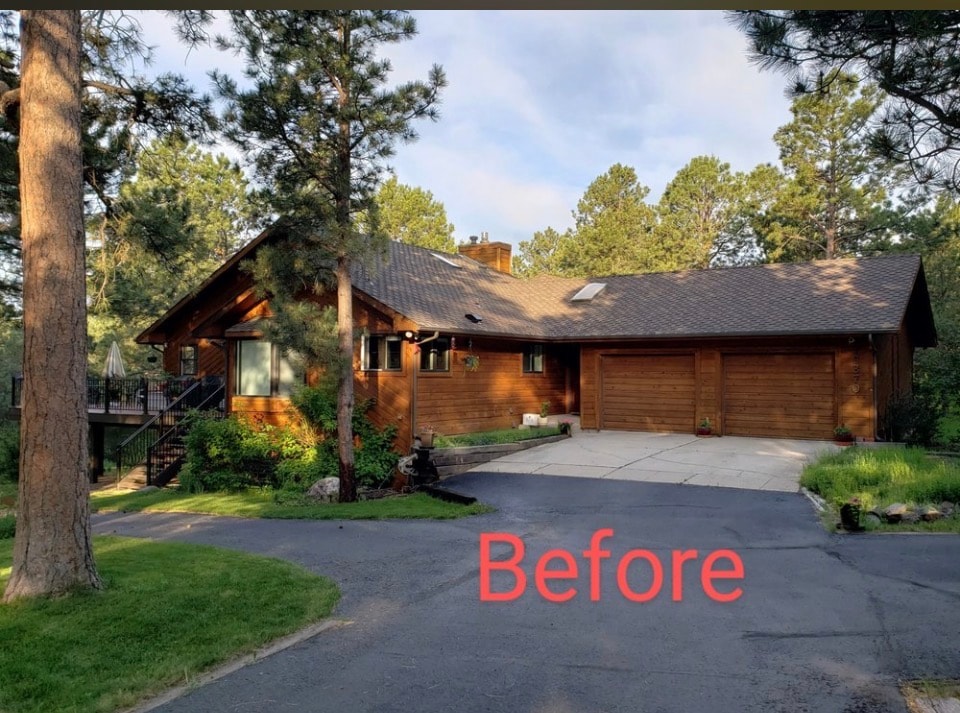 Before: wood siding home exterior in Colorado Springs before painting and stucco work by Confident Coatings
