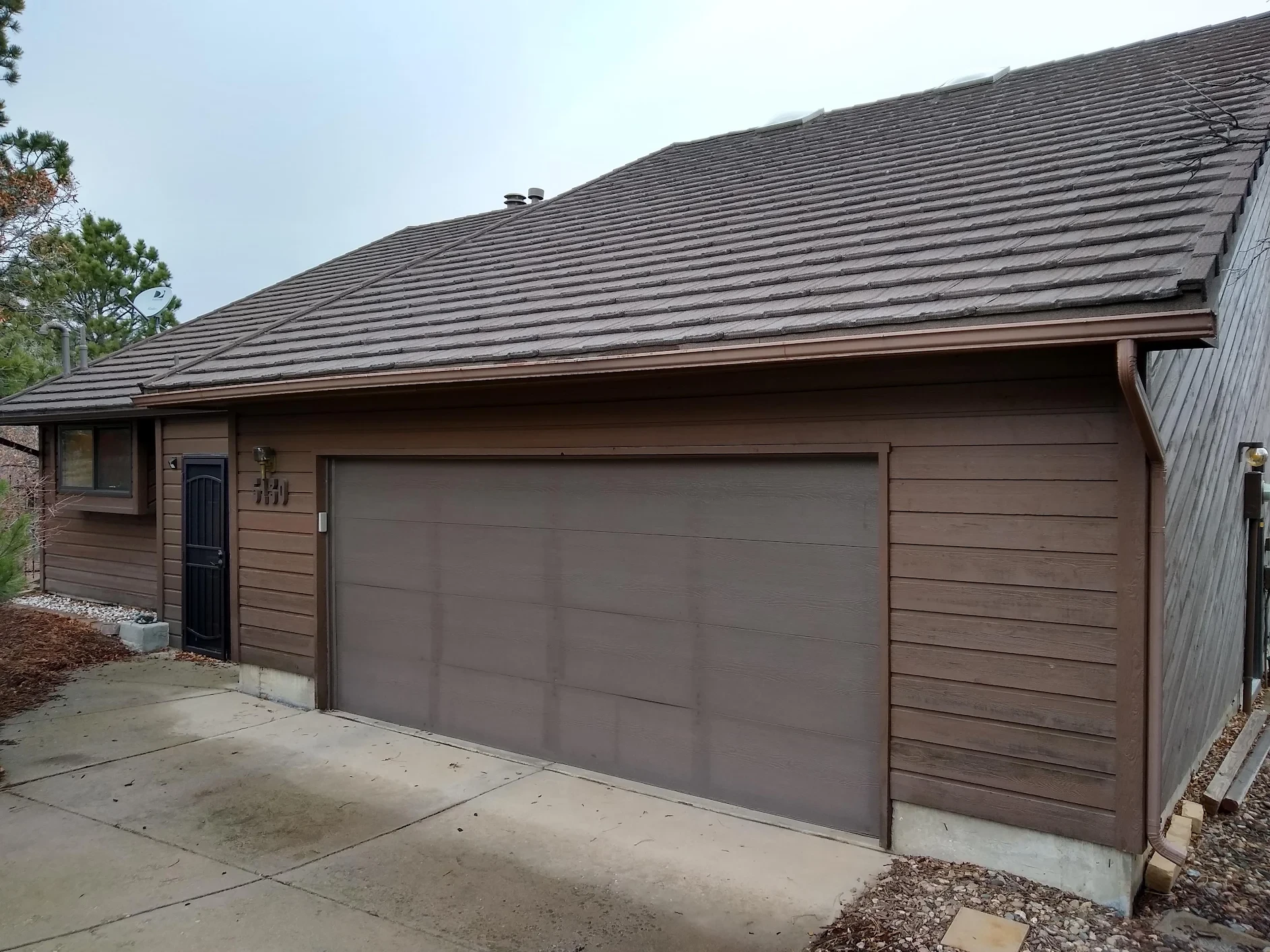Before — home exterior before stucco repair and painting by Confident Coatings