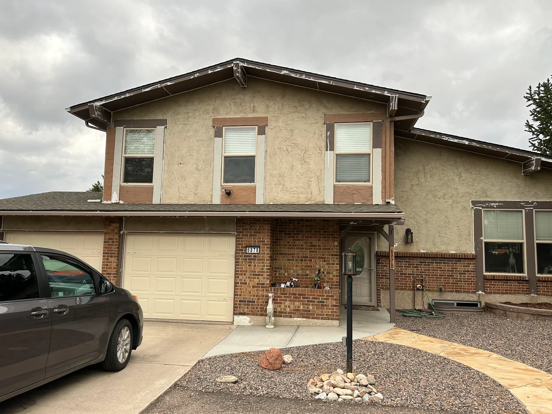 Before — home exterior before stucco repair and painting by Confident Coatings